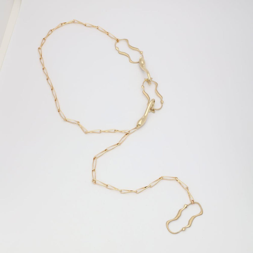 Gold chain necklace on a white background
