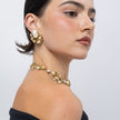 Kira Clip brass earring detail on ear, Pearlita collection