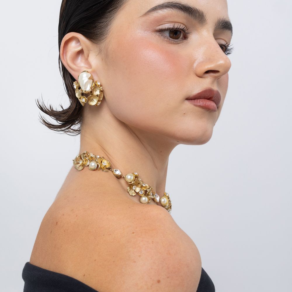 Kira Clip brass earring detail on ear, Pearlita collection