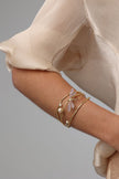 Buzz Bracelet — handmade brass dragonfly bracelet with enamel and freshwater pearls, made in Greece