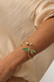Buzz Bracelet on model — artisan brass multi-wire cuff with enamel dragonfly and pearl accents