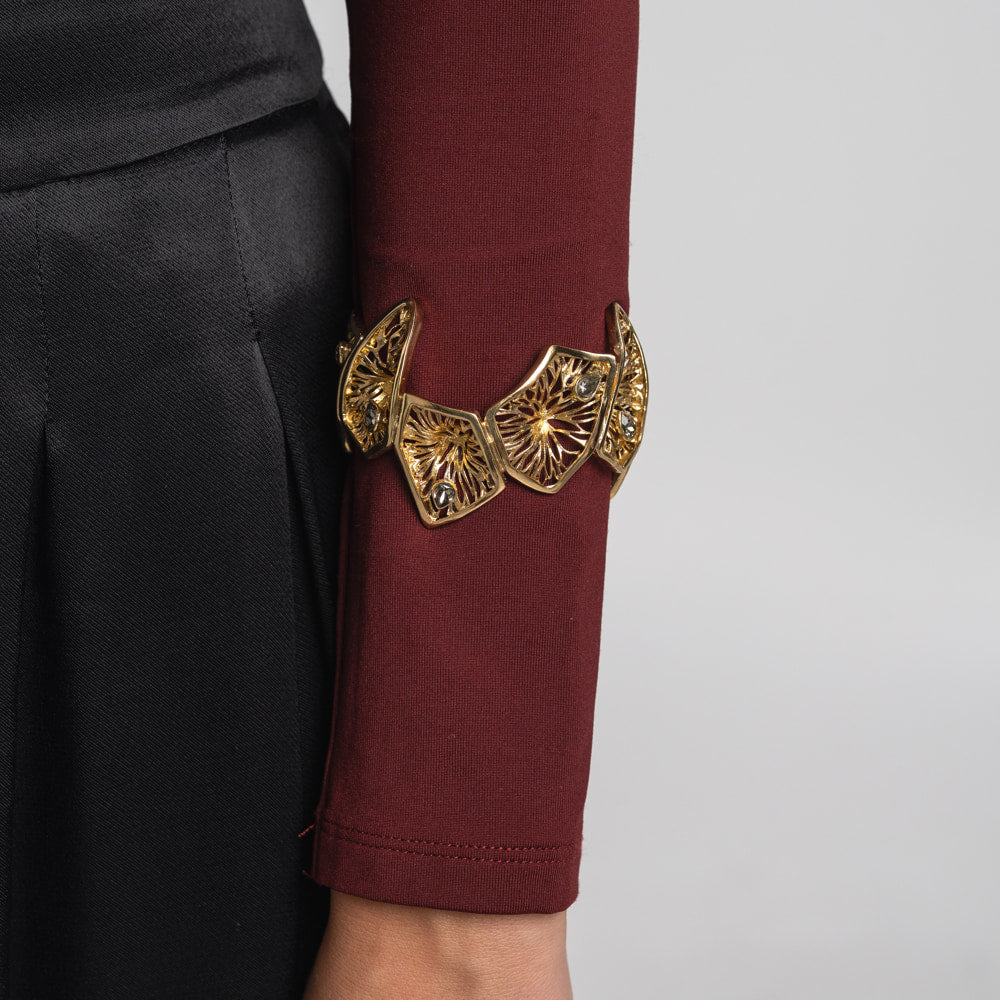 Canopy Bracelet II — handmade brass filigree statement bracelet with crystal stones, worn on model