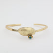 Limpet Bracelet close-up — handmade brass sculptural shell cuff with crystal 
