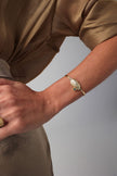 Limpet Bracelet detail — handmade brass statement cuff with organic shell motif, artisan jewelry made in Greece
