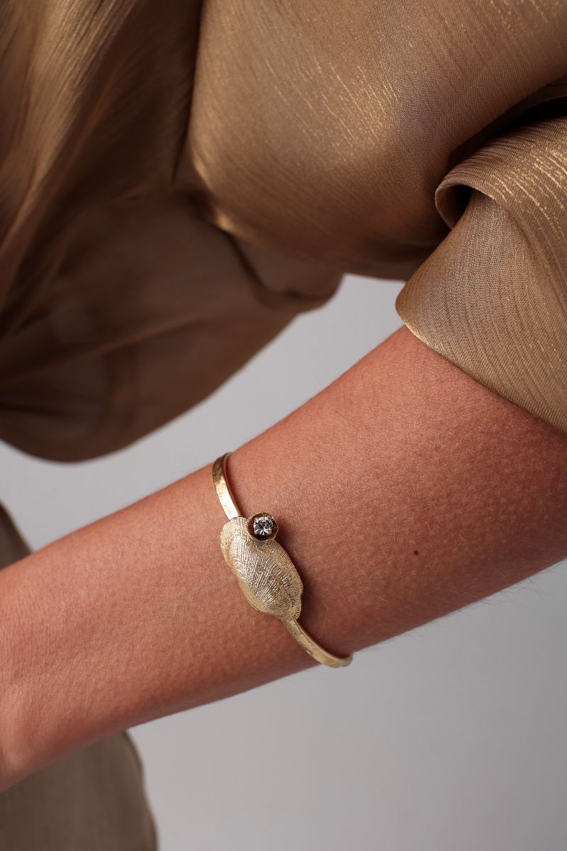 Limpet Bracelet — handmade brass open cuff with textured shell centerpiece and crystal detail o
