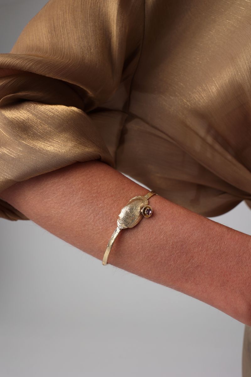 Limpet Bracelet close-up — handmade brass sculptural shell cuff bracelet with crystal accent
