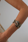 Nerra Bracelet close-up — handmade brass statement cuff bracelet with organic branching texture detail
