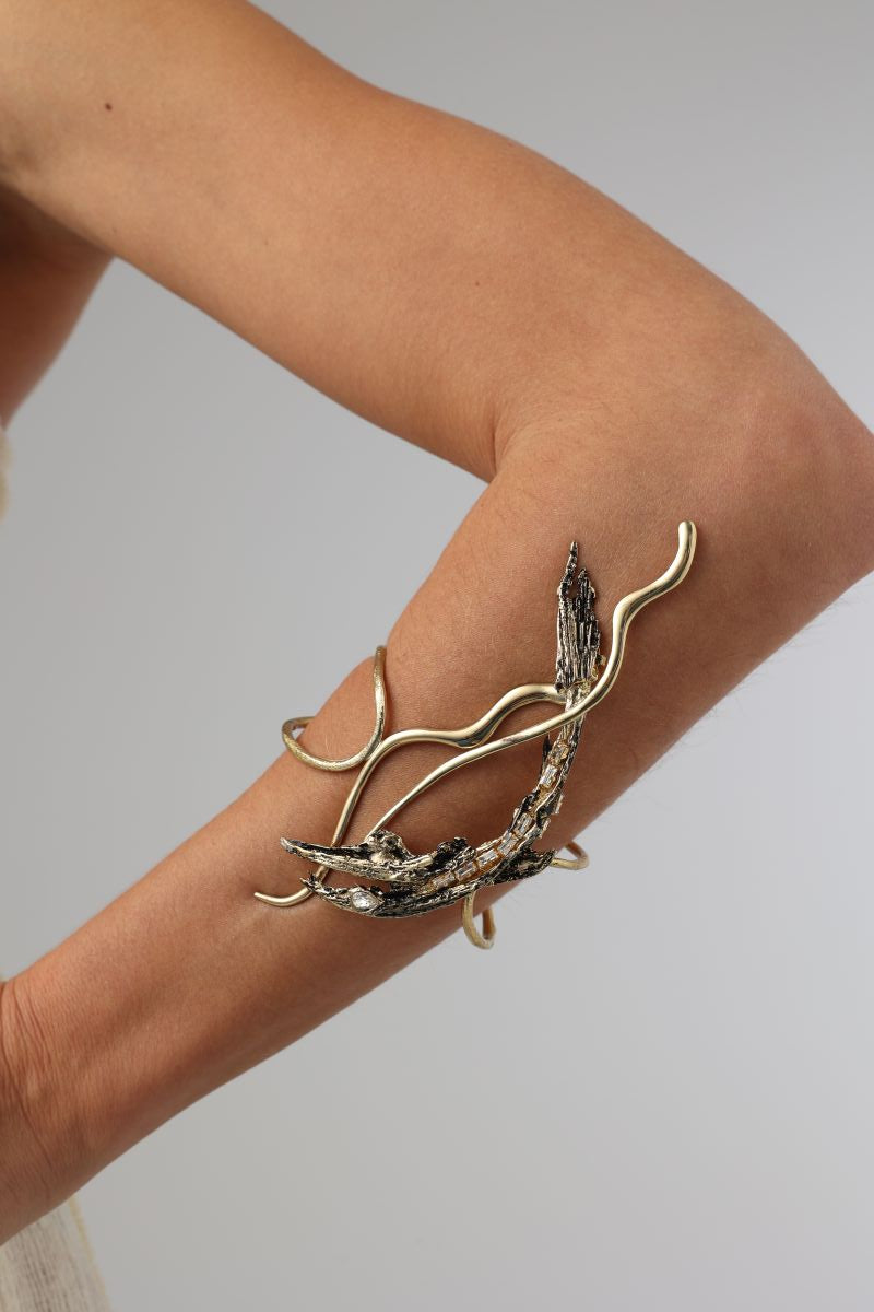 Dragonfish Bracelet close-up — handmade brass and oxidised brass statement cuff with crystal detail