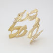 Double Nera Bracelet — handmade brass double cuff with sculptural coral branch structure on white background