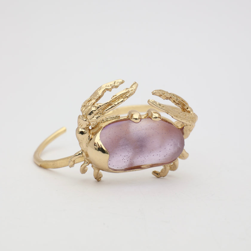 Crabby Bracelet — handmade brass open cuff with sculptural crab motif and resin stone on white background
