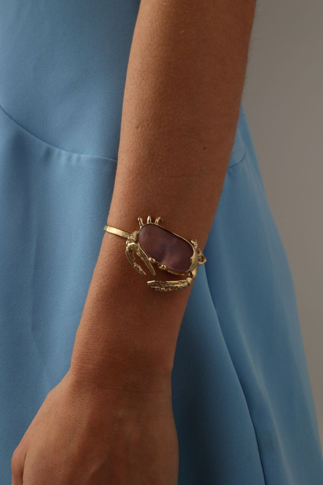 Crabby Bracelet close-up — handmade brass sculptural crab cuff bracelet with large resin stone detail