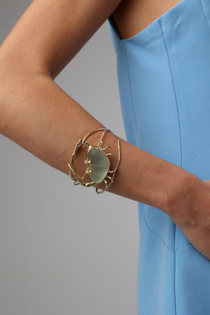 Claw Crabby Bracelet — handmade brass open crab claw cuff with pale resin stone centerpiece
