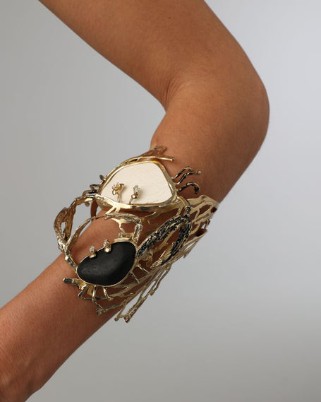 Crabby The Dancers Bracelet — handmade brass statement cuff bracelet with black and white resin stones and crab sculpture