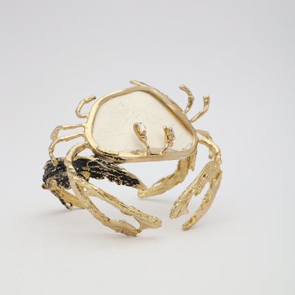 Crasta Bracelet — handmade brass sculptural crab cuff bracelet with resin stone and crystal detail on white background