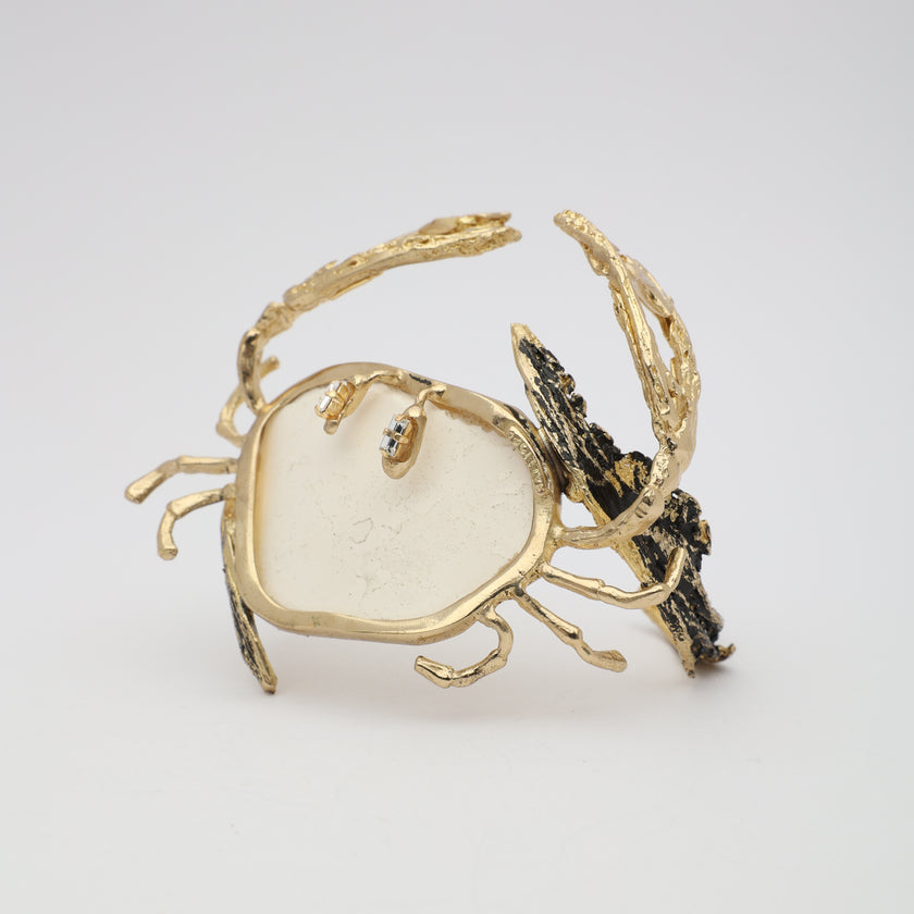Crasta Bracelet angle view — handmade brass sculptural sea creature cuff with organic stone and mixed texture detail