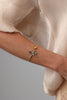 Coralia Bracelet — handmade brass artisan cuff with enamel seahorse, coral and two limpet shell accents
