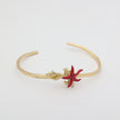 Astel Bracelet — handmade brass artisan cuff bracelet with enamel sea creature and coral detail