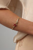 Astel Bracelet — handmade brass open cuff with enamel starfish and coral motif