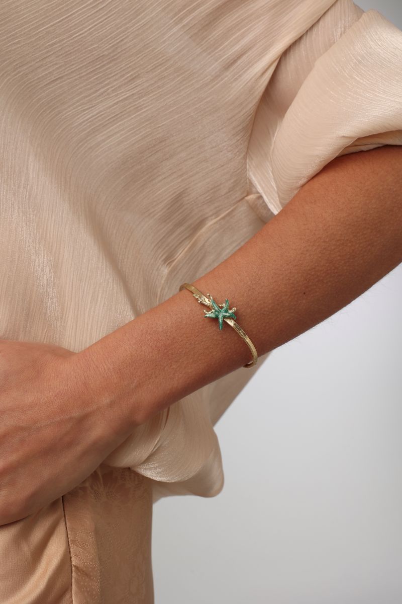 Astel Bracelet — handmade brass slim cuff bracelet with sculpted enamel starfish centerpiece