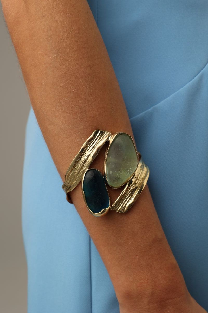 handmade brass gemstone cuff bracelet with two organic freeform stones on model, wrist view