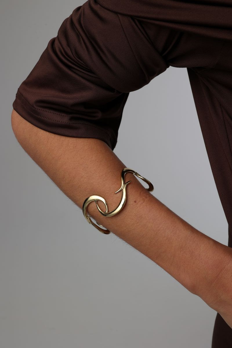 Eternity Single Bracelet — handmade brass sculptural open cuff bracelet worn on model