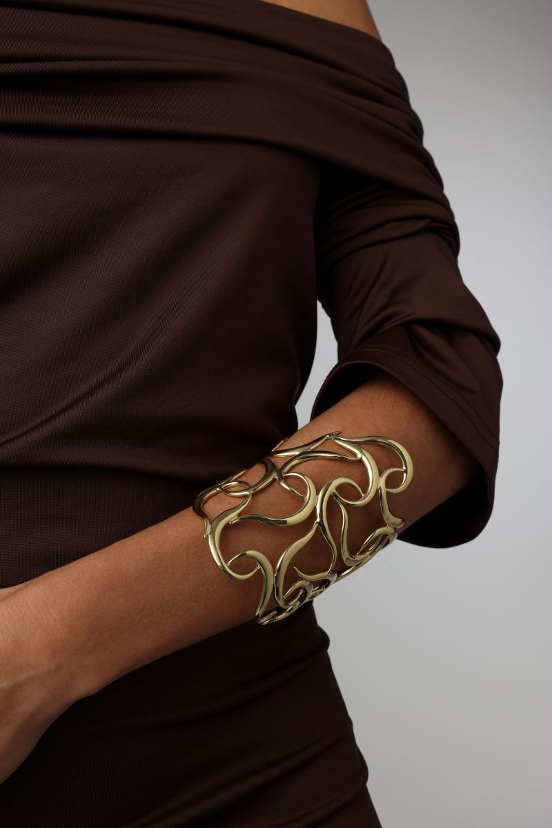 Eternity Bracelet close-up — handmade brass open lattice wide cuff bracelet on model