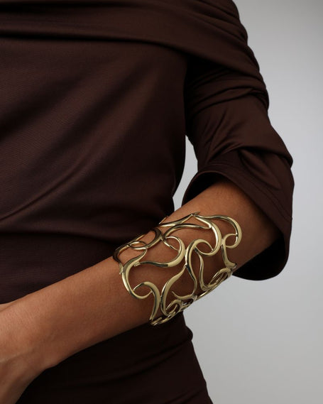 Eternity Bracelet close-up — handmade brass open lattice wide cuff bracelet on model