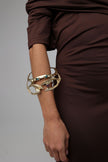 King Astor Bracelet — handmade brass artisan cuff bracelet with teal and purple crystals and pearl centerpiece