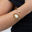 Brass cuff bracelet with sculptural pearl setting, product shot, Bubblegum