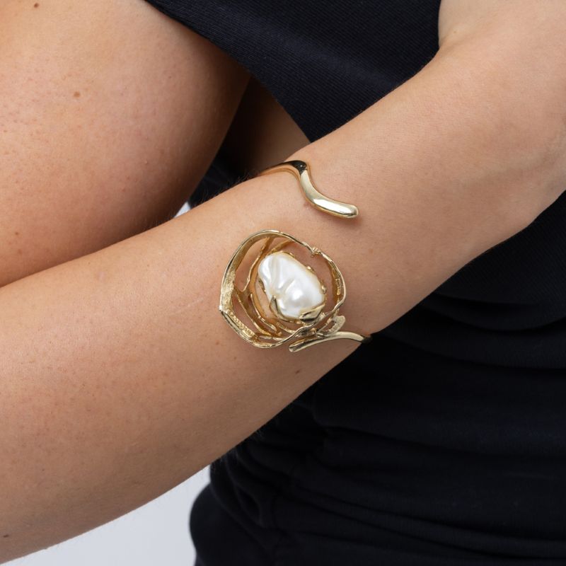 Brass cuff bracelet with sculptural pearl setting, product shot, Bubblegum