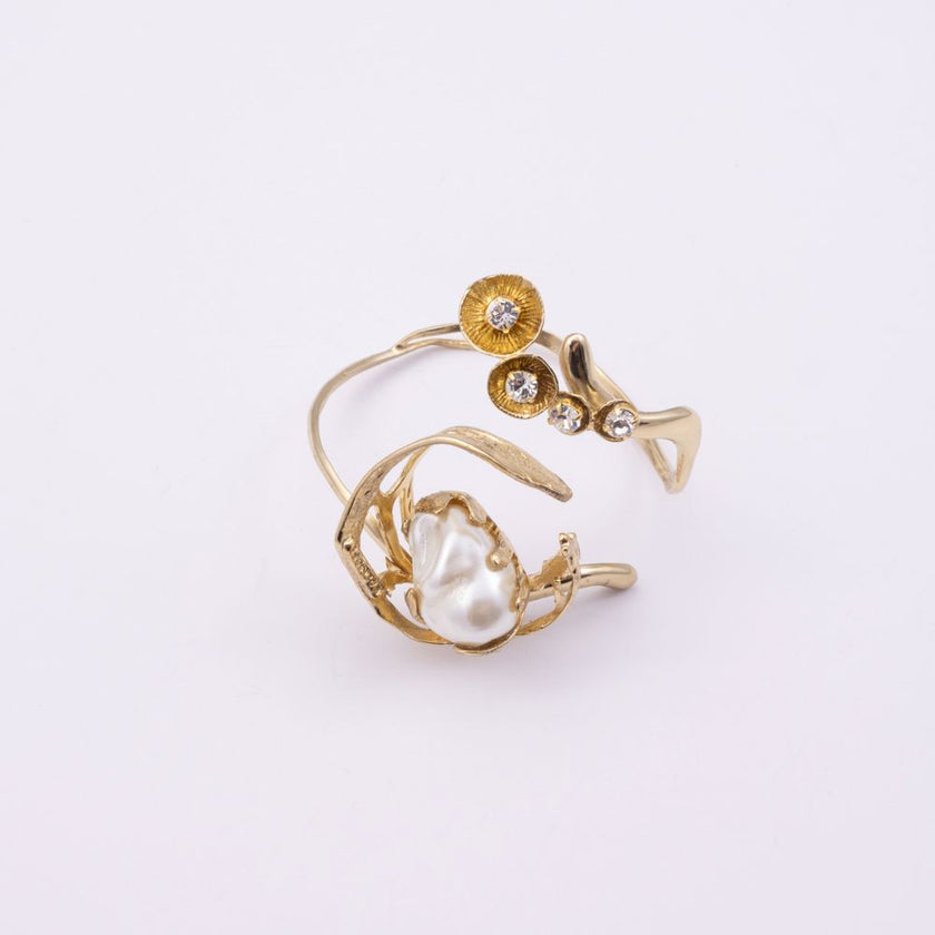 Brass cuff bracelet with pearl nest and crystal floret detail, product shot, Sprinkles