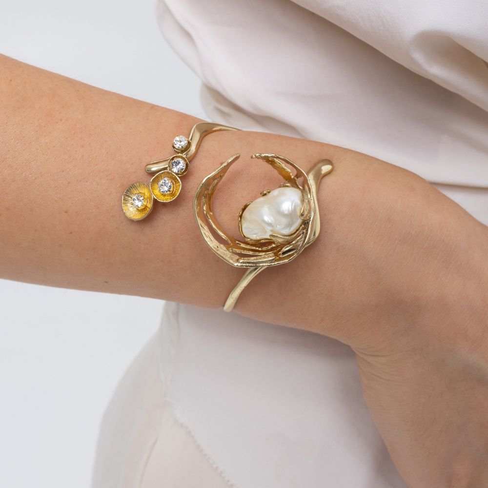 Handmade brass pearl cuff bracelet with crystal florets worn on wrist, Sprinkles
