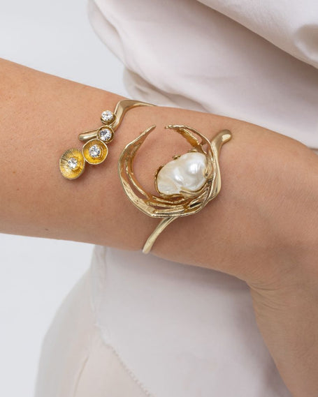 Handmade brass pearl cuff bracelet with crystal florets worn on wrist, Sprinkles