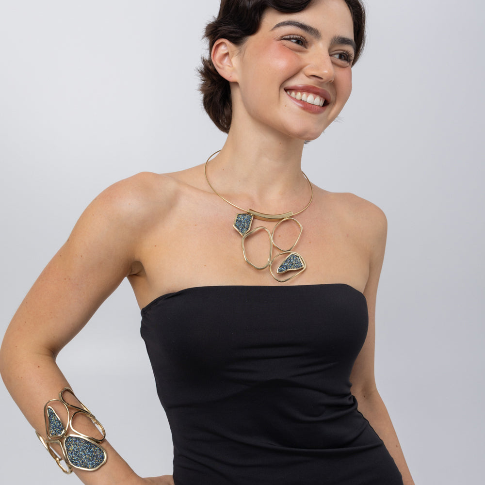 Glow Necklace on model, smile photo: handmade brass statement necklace with open organic loops and crystal shards