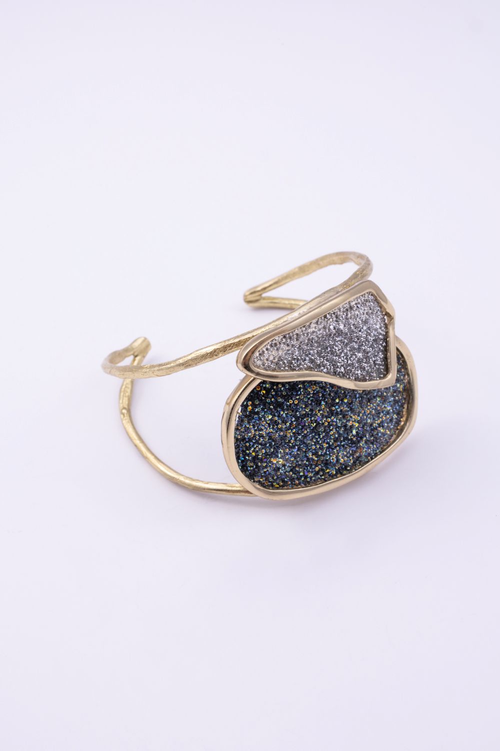 Handmade gold cuff with large oval crystal panel and smaller overlapping crystal panel