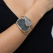 Close-up of double crystal cuff bracelet with hammered gold double band on the wrist