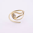 Boteh handmade gold-plated paisley wrap cuff bracelet with textured loops and clear crystal on a white background