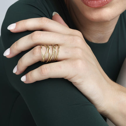 Handmade gold-tone brass multi-strand wire twig ring with organic crisscross design worn on hand — Simple Twig Ring by Kalliope Jewelry, crafted in Greece