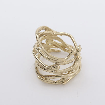 Close-up product shot of handmade brass sculptural wide band ring with woven branch-like open-work design — Foggy Ring by Kalliope Jewelry, crafted in Greece