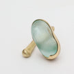 Earthpulse Ring angle view — handmade brass ring with oversized oval centerpiece
