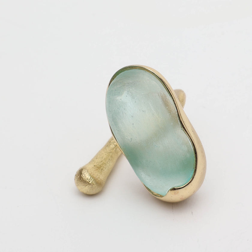 Earthpulse Ring angle view — handmade brass ring with oversized oval centerpiece
