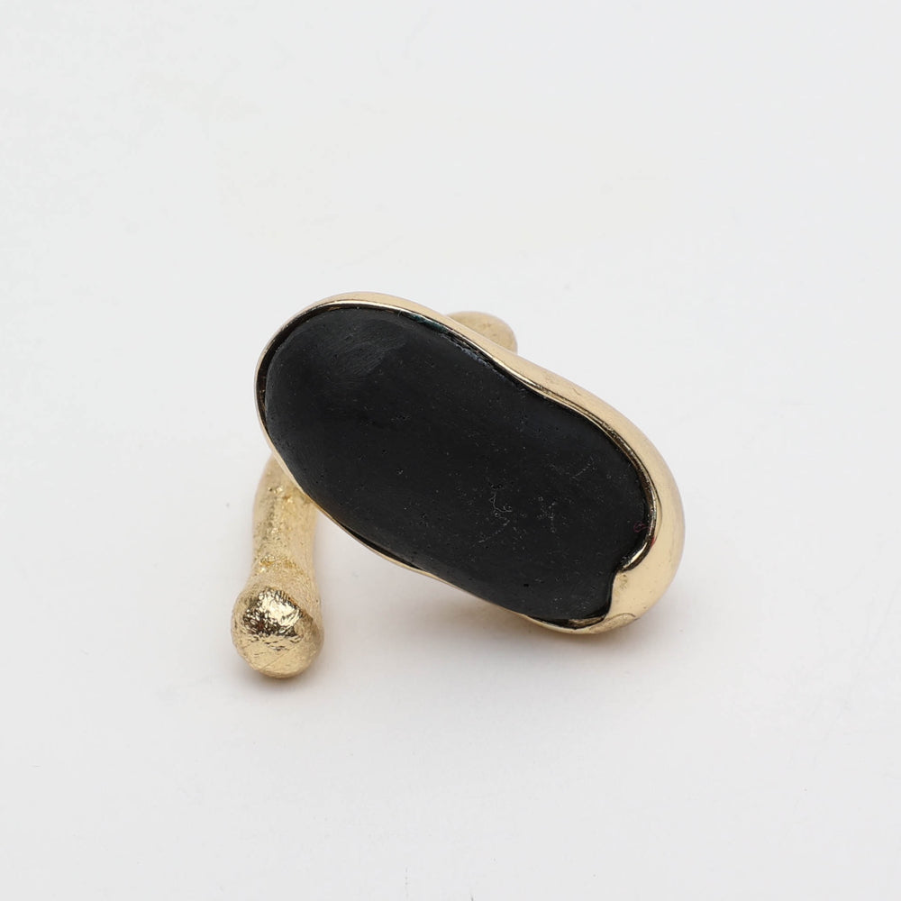 Earthpulse Ring view — handmade brass sculptural ring with smooth resin stone centerpiece
