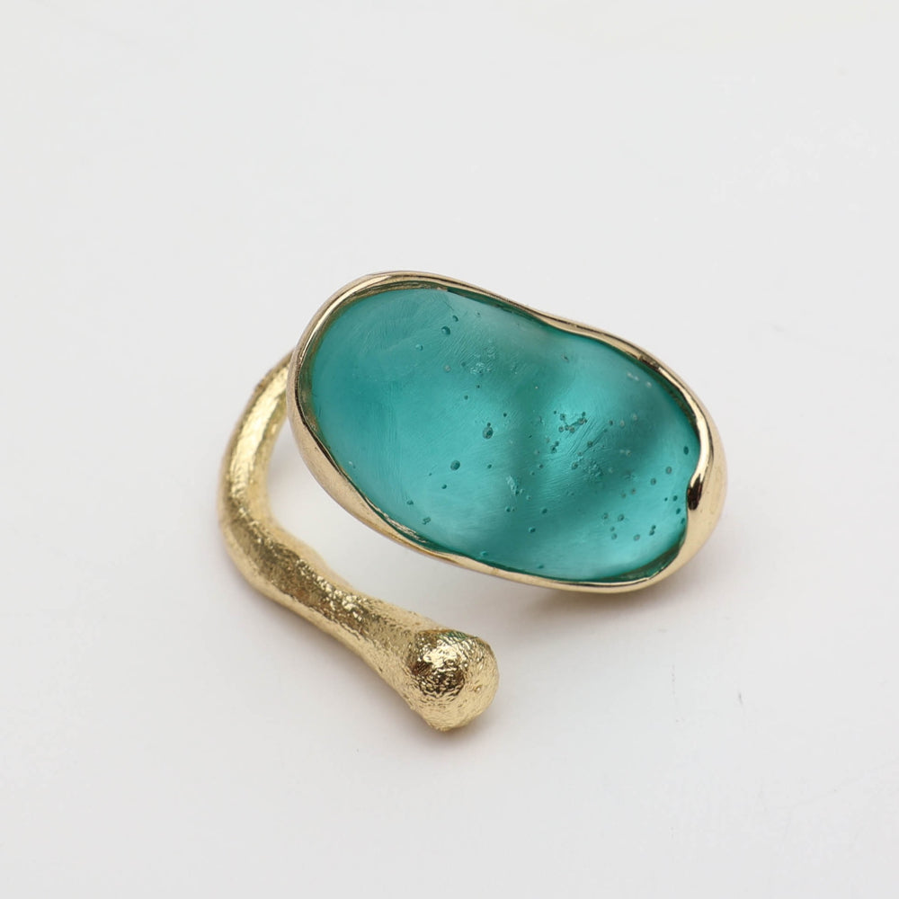 Earthpulse Ring — handmade brass statement ring with oval resin stone on white background
