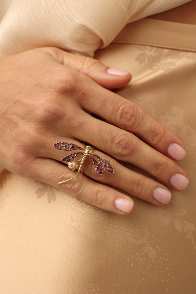 Buzz Ring — handmade brass dragonfly statement ring with enamel wings and freshwater pearl, worn on model