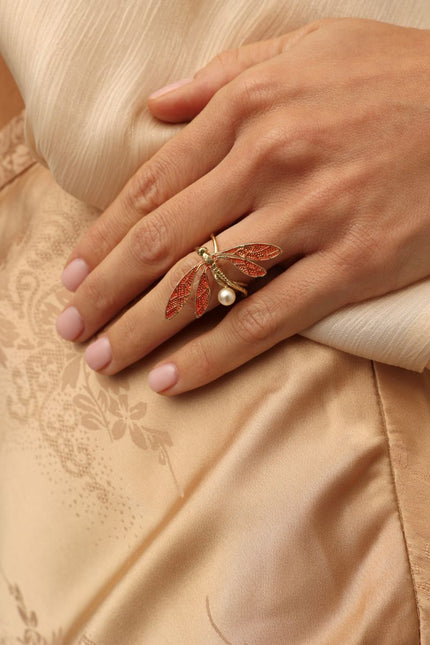 Buzz Ring on model — artisan brass dragonfly ring with enamel and pearl, handmade jewelry