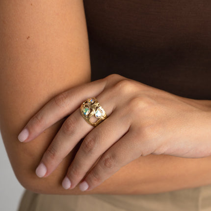 andmade gold-tone brass wide band ring with white crystal stones worn on hand — Gloomy Shiny Ring by Kalliope Jewelry, crafted in Greece
