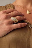 Limpet Ring side view — handmade brass open adjustable ring with curved shell centerpiece