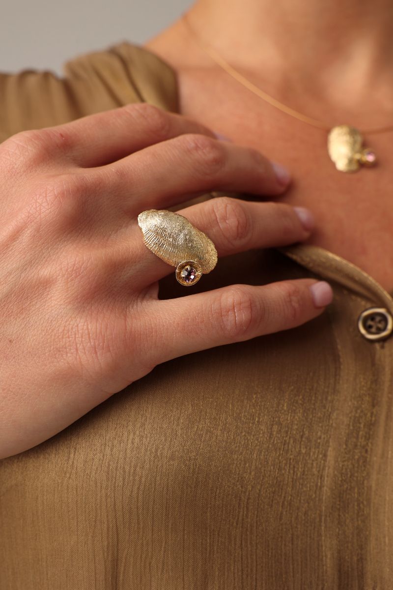Limpet Ring side view — handmade brass open adjustable ring with curved shell centerpiece