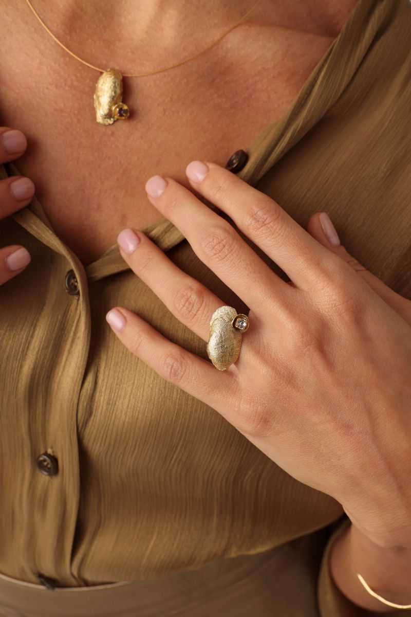 Limpet Ring close-up — handmade brass statement ring with sculptural shell motif and resin stone