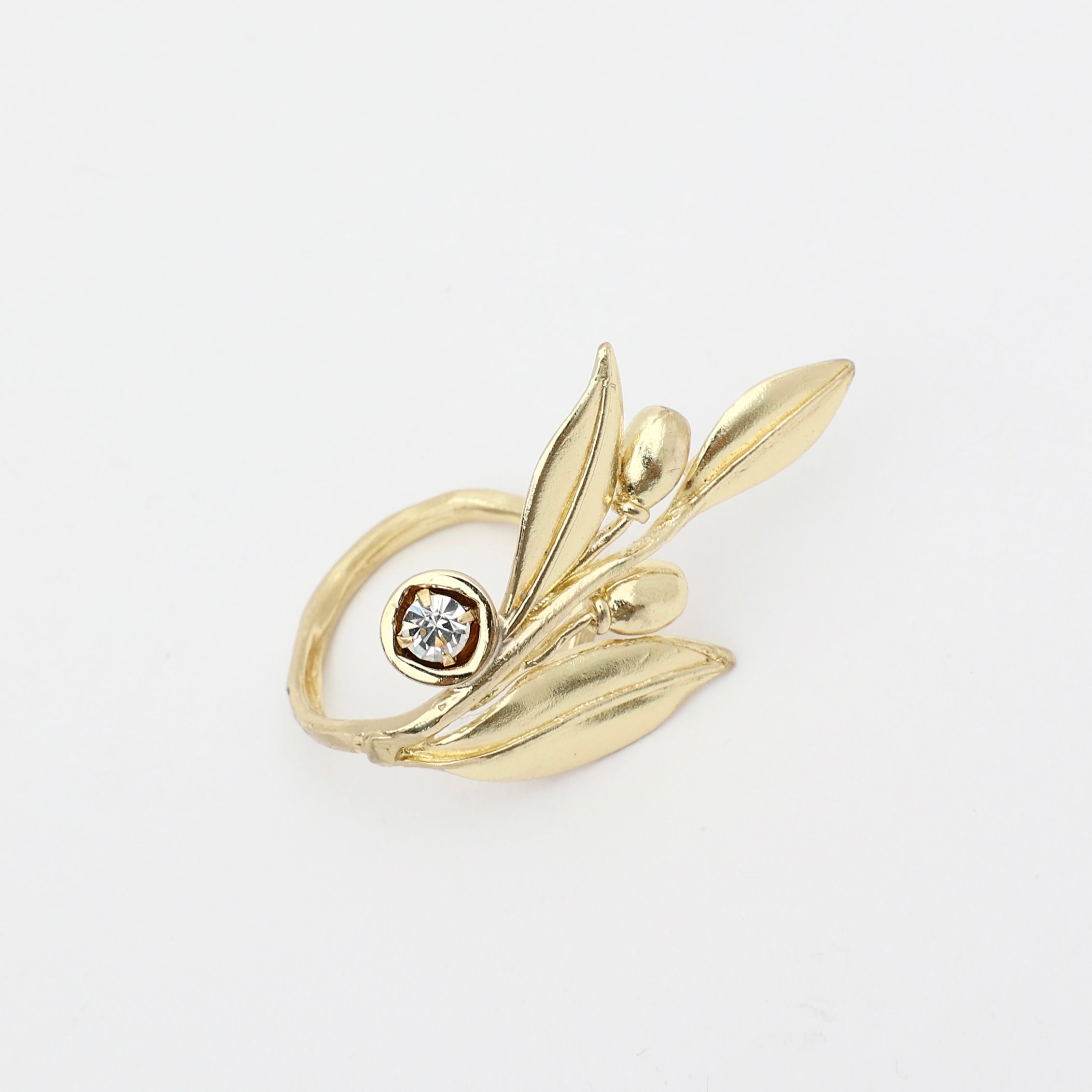 handmade brass nature-inspired statement ring with sculptural leaf and fruit design